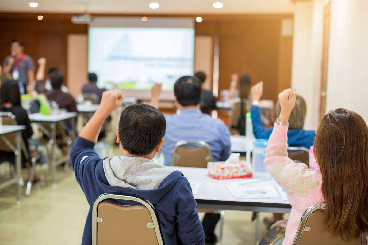 Classroom coaching session with a shipping-industry instructor guiding students through operational material